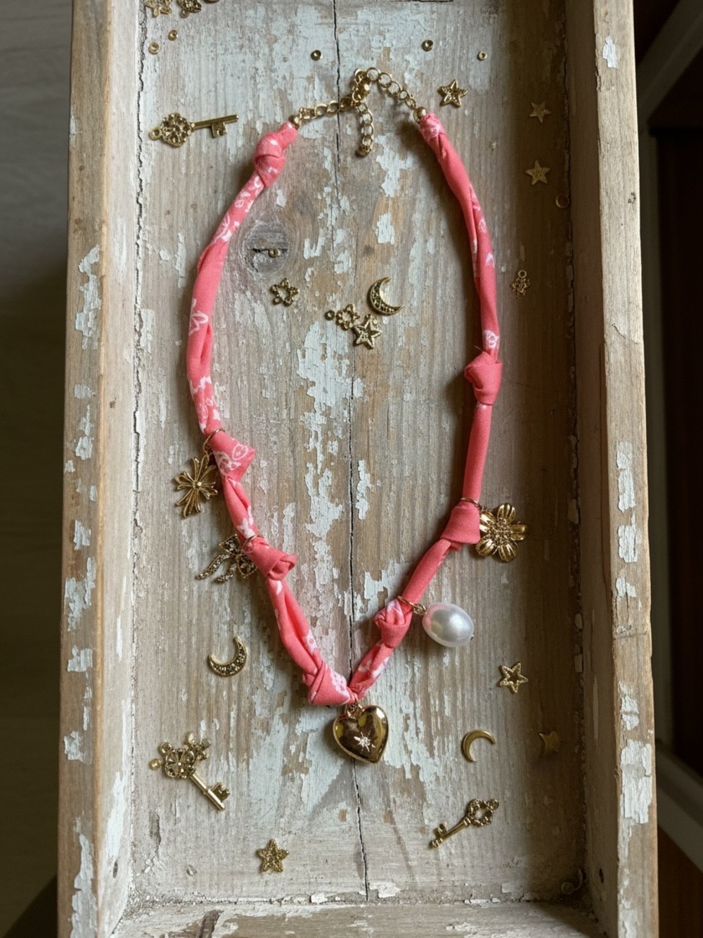 Twelve Pink Fabric Bandana Knot Necklace with Gold Heart, bow, Pearl Charm
NWT